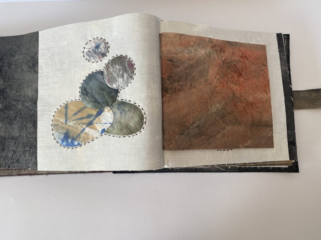 Another page showing small rocks appliqued and stacked