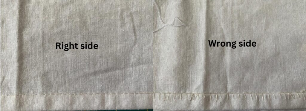 an image showing a piece of vintage fabric with the hand-sewn hem from the right side and the wrong side.