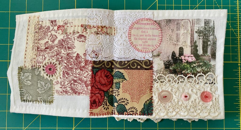 an image showing a double spread page from the Paris book with toile de jouy, vintage fabrics, image transfer, buttons and some lace