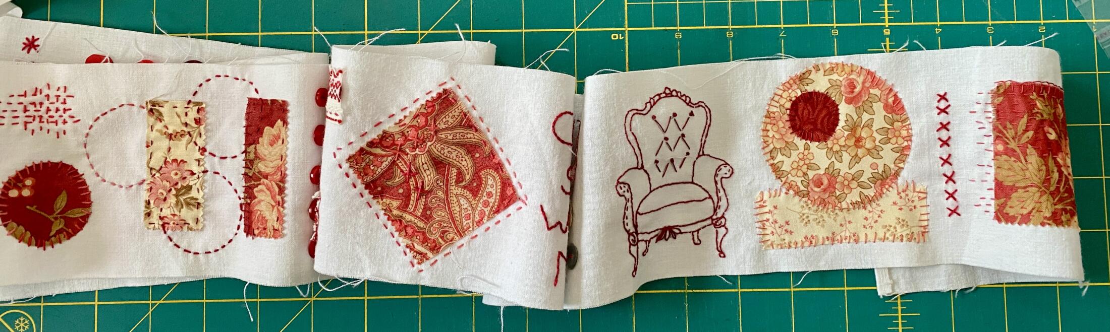 an image showing a piece of the come sit with me scroll where you can appreciate some of the fabrics used, the stitching and some buttons and details.