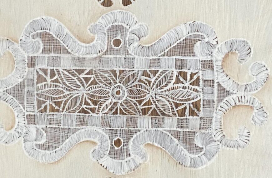 an image showing a close up of the italian lace painted on the seat of the vintage chair