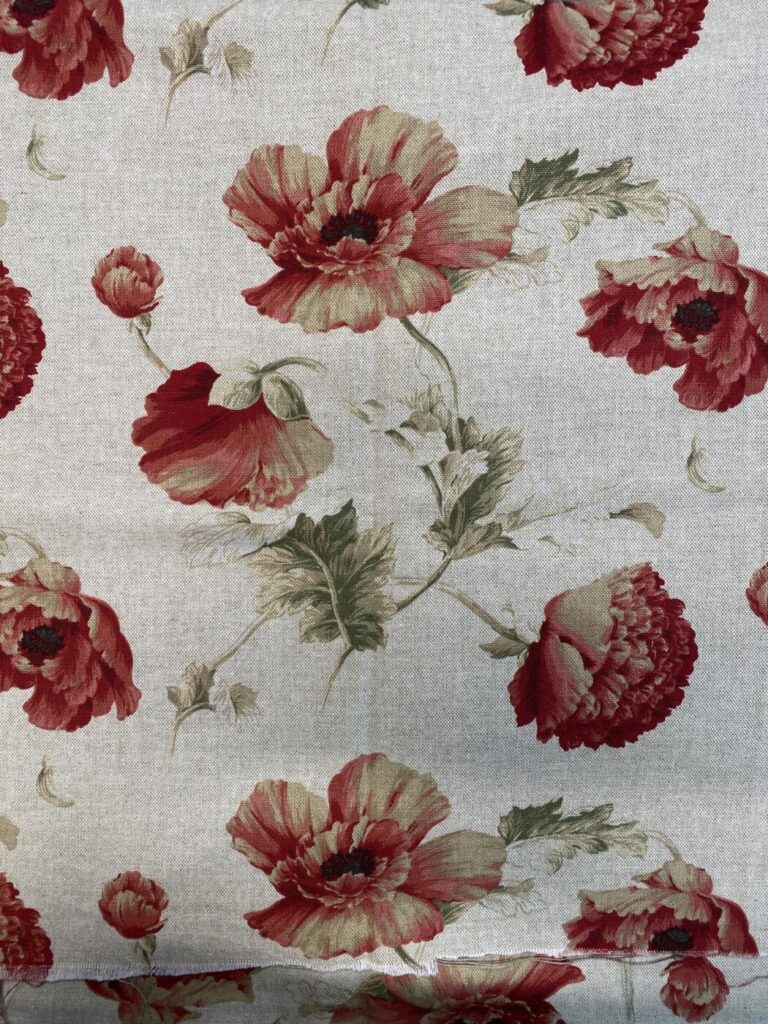 an image of the linen piece of fabric with the peony design used to paint the bak of the chair